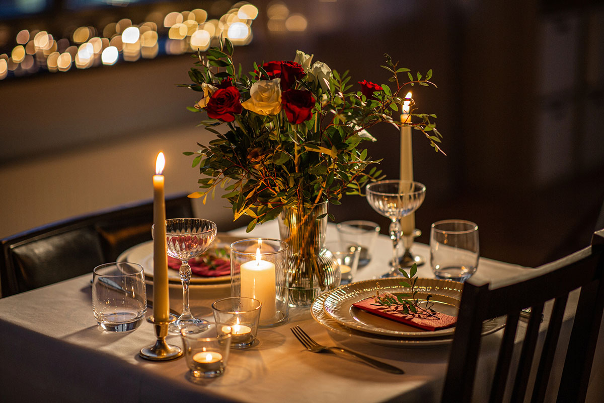 romantic dinner table setting with candles.