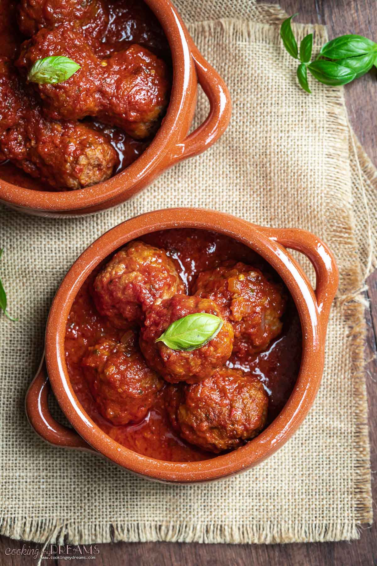 overhead polpette al sugo in a terracotta bowl